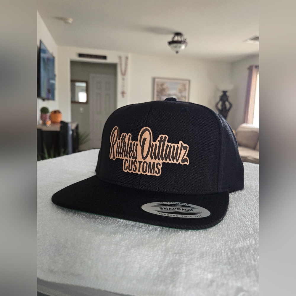 RUTHLESS OUTLAWZ CUSTOMS  LEATHER PATCH  CAP.      (6 PANEL  FLAT CAP)